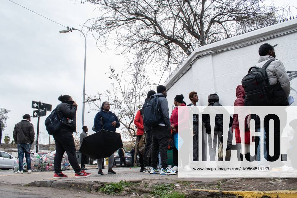 SANTIAGO, CHILE, AUGUST 25, 2026: Haitian citizens gather at the Consulate of Haiti in Santiago to complete paperwork related to the regularization of their immigration status in Chile. Santiago Chile - ZUMAq101 20260825_zna_q101_148