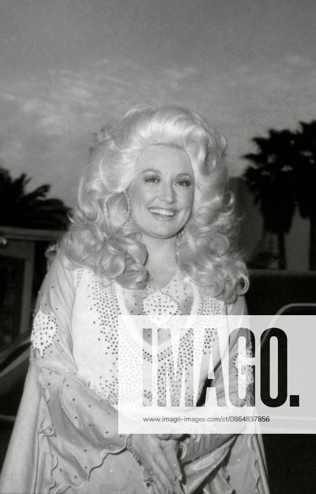 Dolly Parton, the Queen of Country singing icon with a personality as bold as her signature blond coif and rhinestone-encrusted outfits has died. She was 80 years old. FILE PHOTO SHOT ON: Feb. 19, 197: Los Angeles, California, USA - DOLLY PARTON.19TH GRAMMYS. Los Angeles USA - ZUMAg49_ 20030806_gaf_g105_275