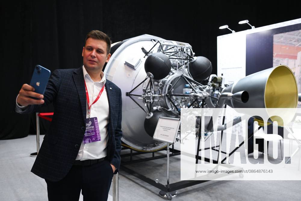 Russia Technoprom International Forum 9228761 26.08.2026 A participant takes a selfie in front of the NK-3 liquid rocket engine from the United Engine Corporation (UEC) displayed at the exhibition during the Technoprom XIII International Forum of Technological Development in Novosibirsk, Russia. Alexandr Kryazhev Sputnik Novosibirsk Russia
