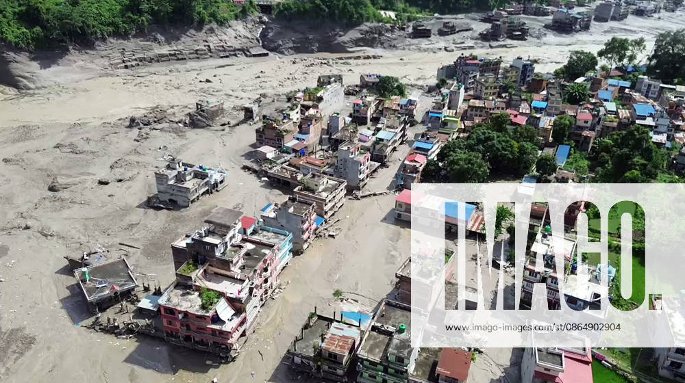 Flash flood ravages Nepals Rasuwa Rasuwa Nepal , Aug 26 (ANI): An aerial view of the houses partially submerged in mud-laden flash flood following an outburst in the Bhotekoshi River, in Rasuwa on Wednesday. (ANI Video Grab) Rasuwa Nepal