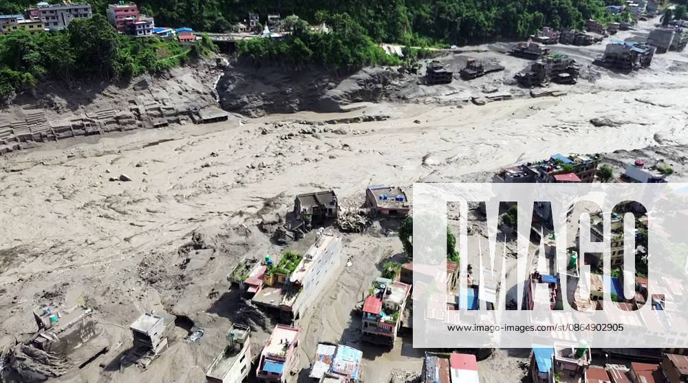Flash flood ravages Nepals Rasuwa Rasuwa Nepal , Aug 26 (ANI): An aerial view of the houses partially submerged in mud-laden flash flood following an outburst in the Bhotekoshi River, in Rasuwa on Wednesday. (ANI Video Grab) Rasuwa Nepal