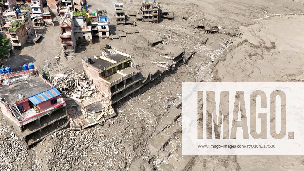 An aerial view shows buildings and infrastructure damaged along the swollen Trishuli River following a massive flash flood triggered by an avalanche of ice and rock in the upper Lhende River on the Tibetan side, in Nuwakot district, Nepal, on Wednesday, August 26, 2026. The sudden flood swept through communities along the Bhote Koshi and Trishuli river systems, destroying homes, roads and bridges and leaving widespread devastation downstream. Nuwakot Nepal - ZUMAg200 20260826_zap_g200_010