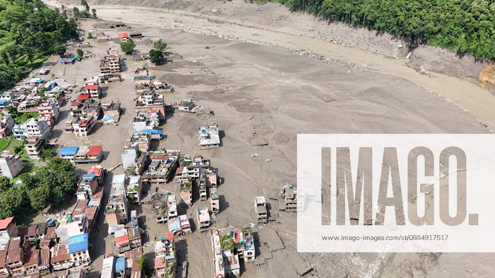 An aerial view shows buildings and infrastructure damaged along the swollen Trishuli River following a massive flash flood triggered by an avalanche of ice and rock in the upper Lhende River on the Tibetan side, in Nuwakot district, Nepal, on Wednesday, August 26, 2026. The sudden flood swept through communities along the Bhote Koshi and Trishuli river systems, destroying homes, roads and bridges and leaving widespread devastation downstream. Nuwakot Nepal - ZUMAg200 20260826_zap_g200_012