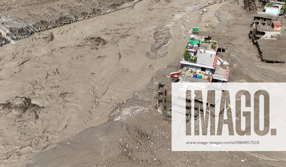 An aerial view shows buildings and infrastructure damaged along the swollen Trishuli River following a massive flash flood triggered by an avalanche of ice and rock in the upper Lhende River on the Tibetan side, in Nuwakot district, Nepal, on Wednesday, August 26, 2026. The sudden flood swept through communities along the Bhote Koshi and Trishuli river systems, destroying homes, roads and bridges and leaving widespread devastation downstream. Nuwakot Nepal - ZUMAg200 20260826_zap_g200_013