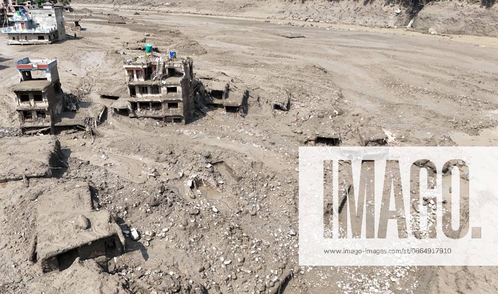 An aerial view shows buildings and infrastructure damaged along the swollen Trishuli River following a massive flash flood triggered by an avalanche of ice and rock in the upper Lhende River on the Tibetan side, in Nuwakot district, Nepal, on Wednesday, August 26, 2026. The sudden flood swept through communities along the Bhote Koshi and Trishuli river systems, destroying homes, roads and bridges and leaving widespread devastation downstream. Nuwakot Nepal - ZUMAg200 20260826_zap_g200_014