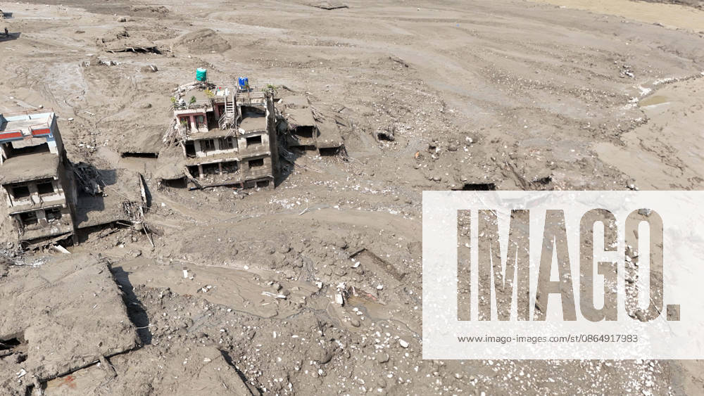 An aerial view shows buildings and infrastructure damaged along the swollen Trishuli River following a massive flash flood triggered by an avalanche of ice and rock in the upper Lhende River on the Tibetan side, in Nuwakot district, Nepal, on Wednesday, August 26, 2026. The sudden flood swept through communities along the Bhote Koshi and Trishuli river systems, destroying homes, roads and bridges and leaving widespread devastation downstream. Nuwakot Nepal - ZUMAg200 20260826_zap_g200_021