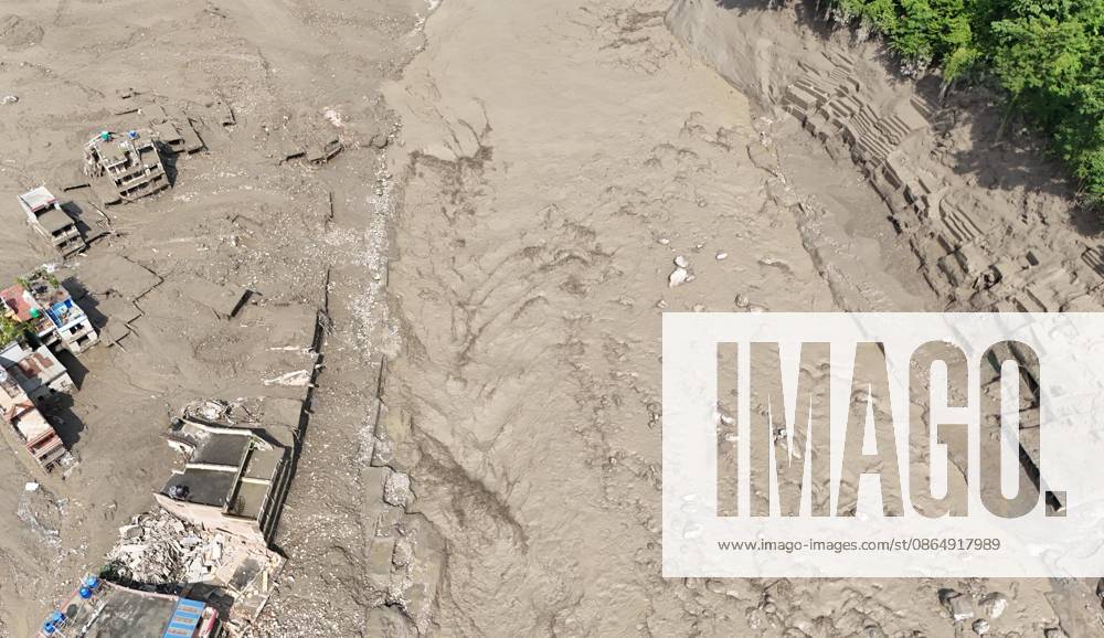 An aerial view shows buildings and infrastructure damaged along the swollen Trishuli River following a massive flash flood triggered by an avalanche of ice and rock in the upper Lhende River on the Tibetan side, in Nuwakot district, Nepal, on Wednesday, August 26, 2026. The sudden flood swept through communities along the Bhote Koshi and Trishuli river systems, destroying homes, roads and bridges and leaving widespread devastation downstream. Nuwakot Nepal - ZUMAg200 20260826_zap_g200_023