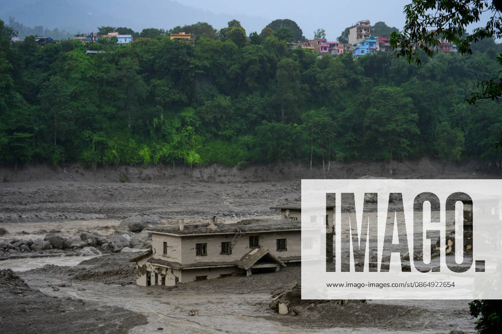 NUWAKOT, NEPAL - AUGUST 26: An aftermath view of flash floods and mudslides along the Trishuli River in Nuwakot, Nepal, on August 26, 2026. A catastrophic flash flood swept through NepalÃ¢â‚¬â ¢s northern border region after an ice-and-rock avalanche, reportedly triggered by an earthquake, caused a sudden surge in the Lhende River on the Nepal-China border and sent massive volumes of water, mud and debris downstream into the Bhote Koshi and Trishuli river systems. The disaster devastated settlements in Rasuwa and Nuwakot districts, sweeping away homes, roads, bridges, vehicles and other infrastructure and severely damaging hydropower and power facilities. In Nuwakot, riverside settlements includin - ZUMAs330 20260826_zsp_s330_001