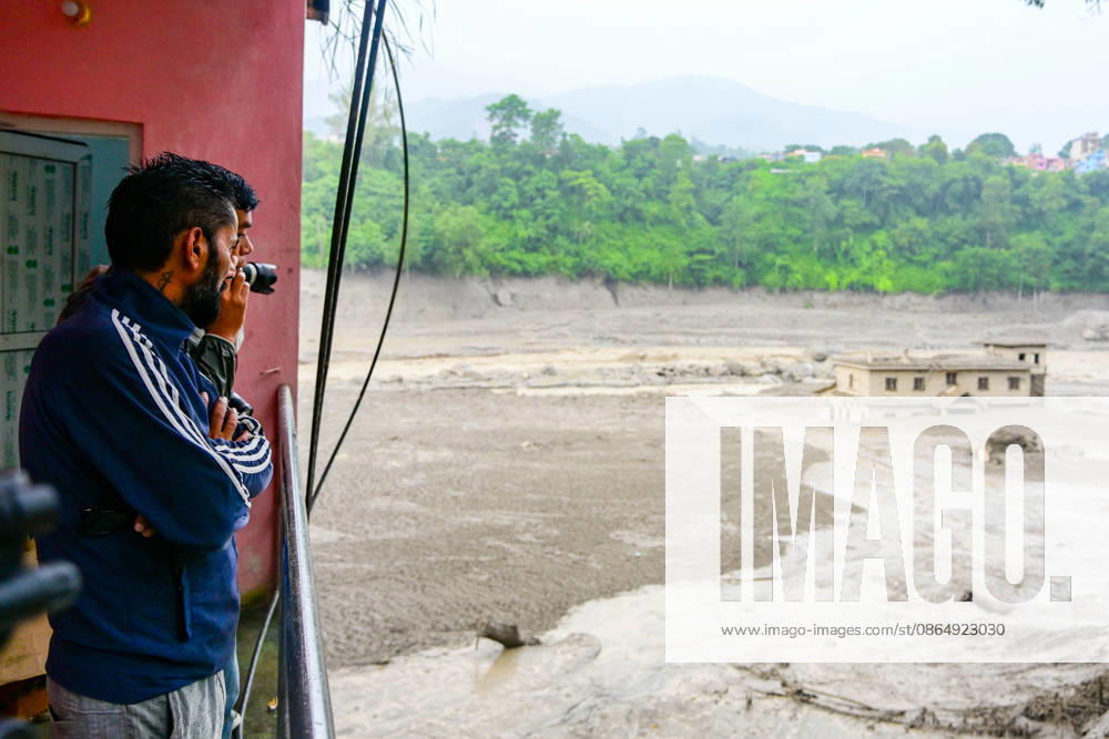 NUWAKOT, NEPAL - AUGUST 26: An aftermath view of flash floods and mudslides along the Trishuli River in Nuwakot, Nepal, on August 26, 2026. A catastrophic flash flood swept through NepalÃ¢â‚¬â ¢s northern border region after an ice-and-rock avalanche, reportedly triggered by an earthquake, caused a sudden surge in the Lhende River on the Nepal-China border and sent massive volumes of water, mud and debris downstream into the Bhote Koshi and Trishuli river systems. The disaster devastated settlements in Rasuwa and Nuwakot districts, sweeping away homes, roads, bridges, vehicles and other infrastructure and severely damaging hydropower and power facilities. In Nuwakot, riverside settlements includin - ZUMAs330 20260826_zsp_s330_009