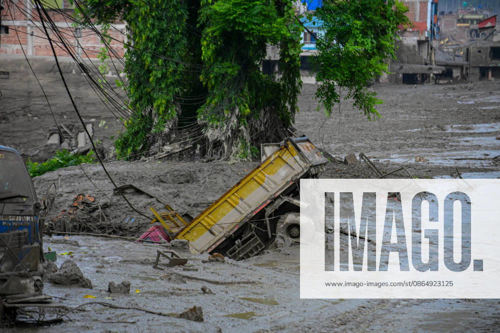 NUWAKOT, NEPAL - AUGUST 26: An aftermath view of flash floods and mudslides along the Trishuli River in Nuwakot, Nepal, on August 26, 2026. A catastrophic flash flood swept through NepalÃ¢â‚¬â ¢s northern border region after an ice-and-rock avalanche, reportedly triggered by an earthquake, caused a sudden surge in the Lhende River on the Nepal-China border and sent massive volumes of water, mud and debris downstream into the Bhote Koshi and Trishuli river systems. The disaster devastated settlements in Rasuwa and Nuwakot districts, sweeping away homes, roads, bridges, vehicles and other infrastructure and severely damaging hydropower and power facilities. In Nuwakot, riverside settlements includin - ZUMAs330 20260826_zsp_s330_017