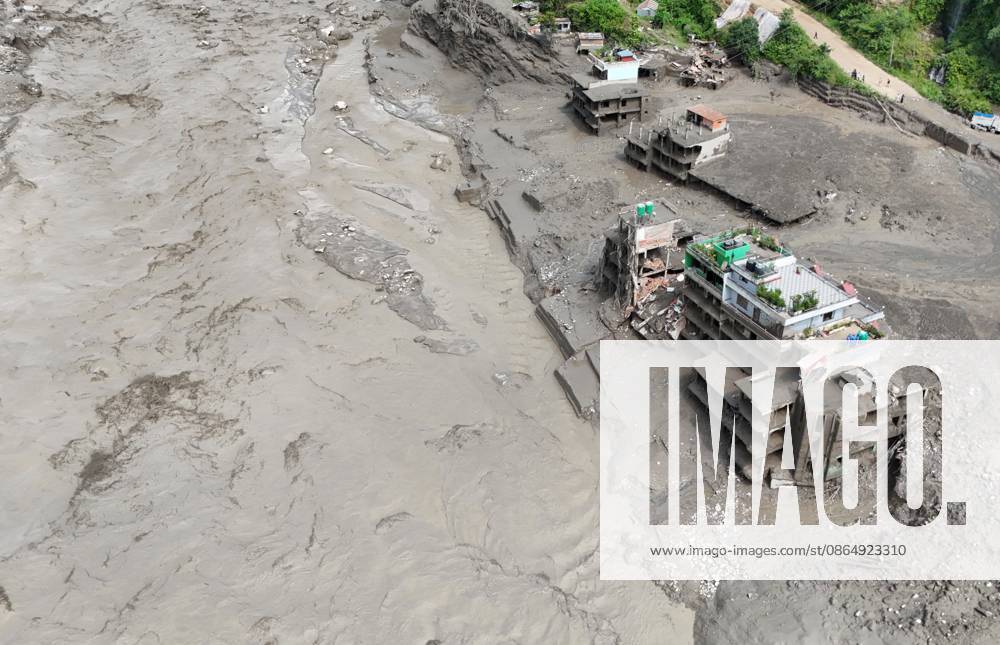 An aerial view shows buildings and infrastructure damaged along the swollen Trishuli River following a massive flash flood triggered by an avalanche of ice and rock in the upper Lhende River on the Tibetan side, in Nuwakot district, Nepal, on Wednesday, August 26, 2026. The sudden flood swept through communities along the Bhote Koshi and Trishuli river systems, destroying homes, roads and bridges and leaving widespread devastation downstream. Nuwakot Nepal - ZUMAg200 20260826_zap_g200_017