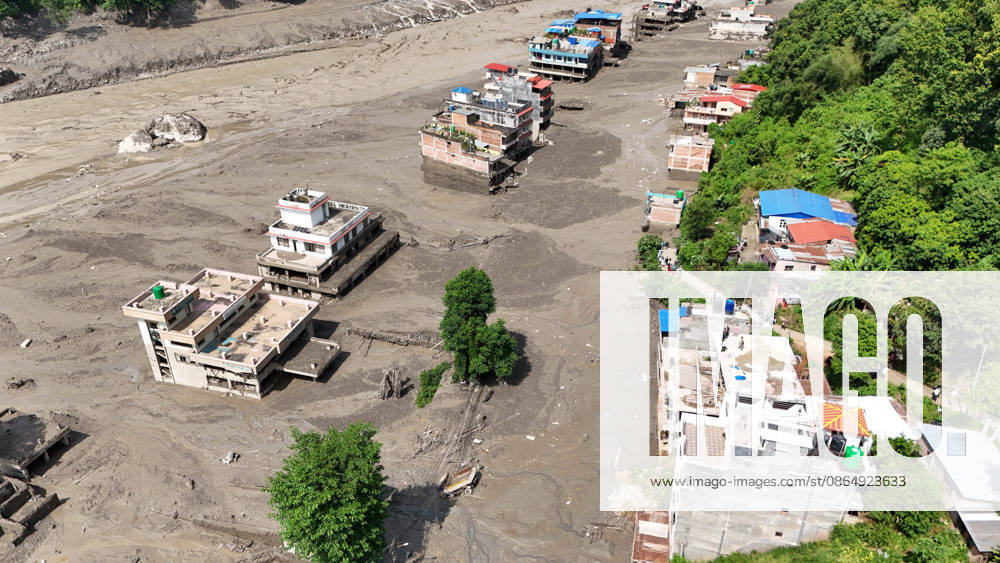 An aerial view shows buildings and infrastructure damaged along the swollen Trishuli River following a massive flash flood triggered by an avalanche of ice and rock in the upper Lhende River on the Tibetan side, in Nuwakot district, Nepal, on Wednesday, August 26, 2026. The sudden flood swept through communities along the Bhote Koshi and Trishuli river systems, destroying homes, roads and bridges and leaving widespread devastation downstream. Nuwakot Nepal - ZUMAg200 20260826_zap_g200_007