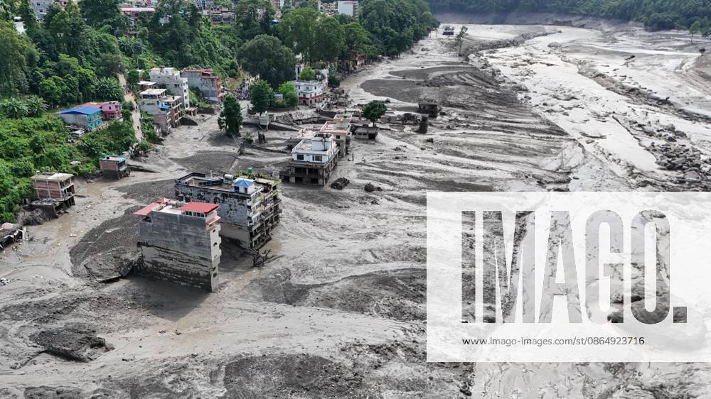 An aerial view shows buildings and infrastructure damaged along the swollen Trishuli River following a massive flash flood triggered by an avalanche of ice and rock in the upper Lhende River on the Tibetan side, in Nuwakot district, Nepal, on Wednesday, August 26, 2026. The sudden flood swept through communities along the Bhote Koshi and Trishuli river systems, destroying homes, roads and bridges and leaving widespread devastation downstream. Nuwakot Nepal - ZUMAg200 20260826_zap_g200_018