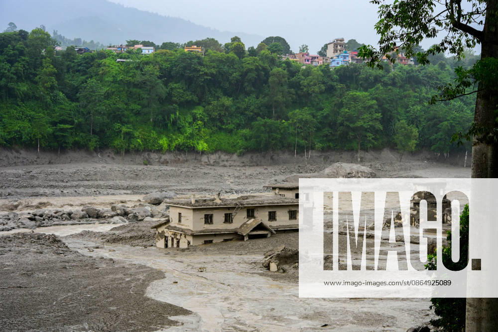 NUWAKOT, NEPAL - AUGUST 26: An aftermath view of flash floods and mudslides along the Trishuli River in Nuwakot, Nepal, on August 26, 2026. A catastrophic flash flood swept through NepalÃ¢â‚¬â ¢s northern border region after an ice-and-rock avalanche, reportedly triggered by an earthquake, caused a sudden surge in the Lhende River on the Nepal-China border and sent massive volumes of water, mud and debris downstream into the Bhote Koshi and Trishuli river systems. The disaster devastated settlements in Rasuwa and Nuwakot districts, sweeping away homes, roads, bridges, vehicles and other infrastructure and severely damaging hydropower and power facilities. In Nuwakot, riverside settlements includin - ZUMAs330 20260826_zsp_s330_041