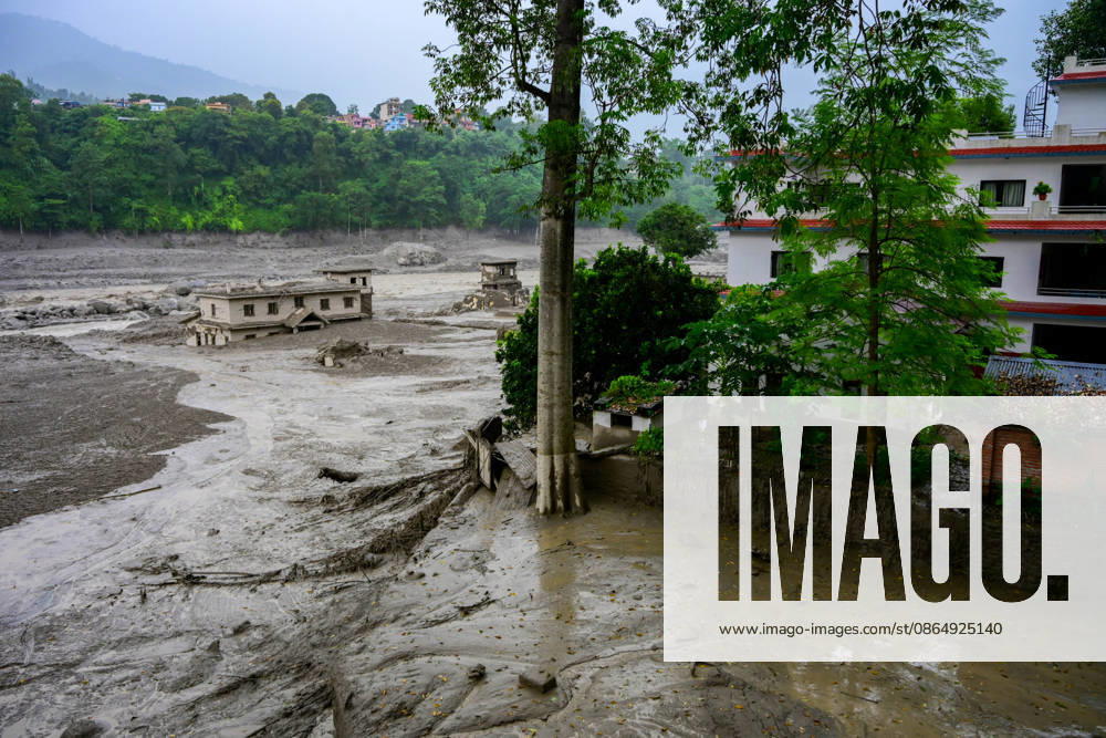 NUWAKOT, NEPAL - AUGUST 26: An aftermath view of flash floods and mudslides along the Trishuli River in Nuwakot, Nepal, on August 26, 2026. A catastrophic flash flood swept through Nepalâ€⠢s northern border region after an ice-and-rock avalanche, reportedly triggered by an earthquake, caused a sudden surge in the Lhende River on the Nepal-China border and sent massive volumes of water, mud and debris downstream into the Bhote Koshi and Trishuli river systems. The disaster devastated settlements in Rasuwa and Nuwakot districts, sweeping away homes, roads, bridges, vehicles and other infrastructure and severely damaging hydropower and power facilities. In Nuwakot, riverside settlements includin - ZUMAs330 20260826_zsp_s330_042