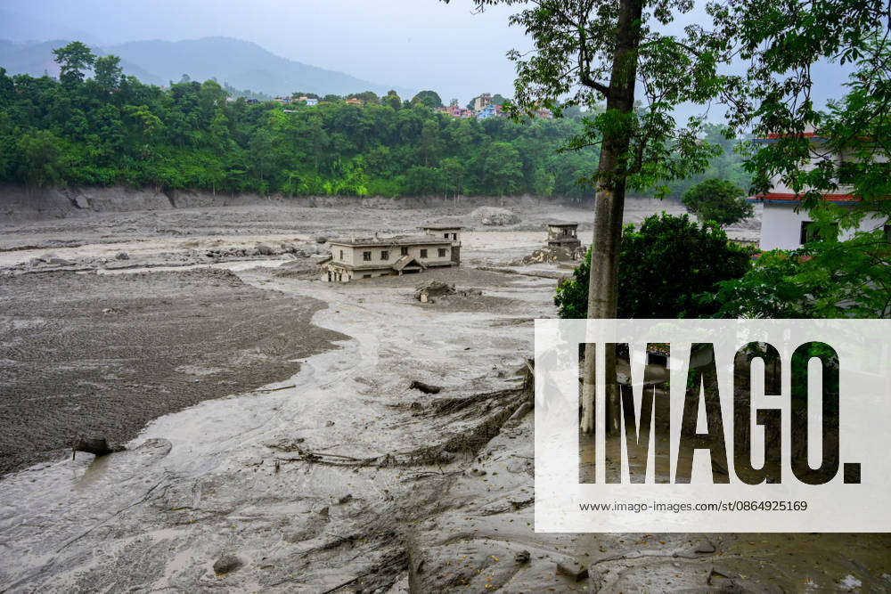 NUWAKOT, NEPAL - AUGUST 26: An aftermath view of flash floods and mudslides along the Trishuli River in Nuwakot, Nepal, on August 26, 2026. A catastrophic flash flood swept through NepalÃ¢â‚¬â ¢s northern border region after an ice-and-rock avalanche, reportedly triggered by an earthquake, caused a sudden surge in the Lhende River on the Nepal-China border and sent massive volumes of water, mud and debris downstream into the Bhote Koshi and Trishuli river systems. The disaster devastated settlements in Rasuwa and Nuwakot districts, sweeping away homes, roads, bridges, vehicles and other infrastructure and severely damaging hydropower and power facilities. In Nuwakot, riverside settlements includin - ZUMAs330 20260826_zsp_s330_043