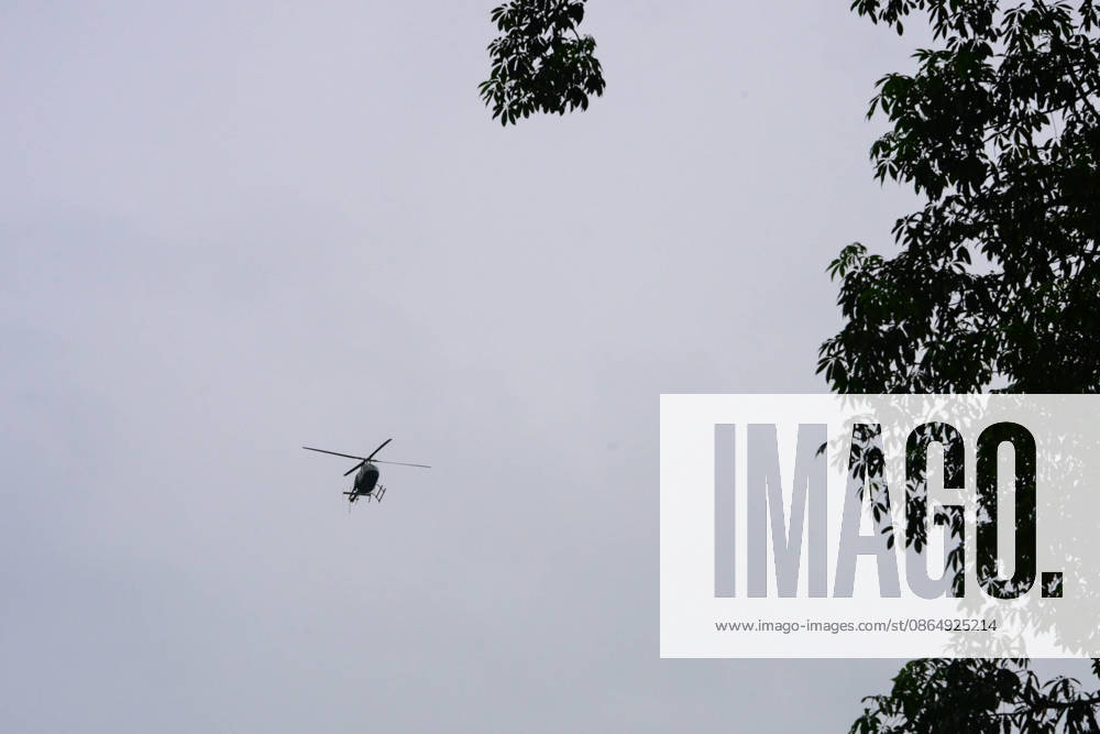 NUWAKOT, NEPAL - AUGUST 26: A helicopter conducts rescue operations over areas affected by flash floods and mudslides along the Trishuli River in Nuwakot, Nepal, on August 26, 2026. A catastrophic flash flood swept through Nepalâ€⠢s northern border region after an ice-and-rock avalanche caused a sudden surge in the Lhende River near the Nepal-China border, sending massive volumes of water, mud and debris downstream into the Bhote Koshi and Trishuli river systems. The disaster devastated settlements in Rasuwa and Nuwakot districts, sweeping away homes, roads, bridges, vehicles and other infrastructure and severely damaging hydropower and power facilities. In Nuwakot, riverside settlements incl - ZUMAs330 20260826_zsp_s330_046