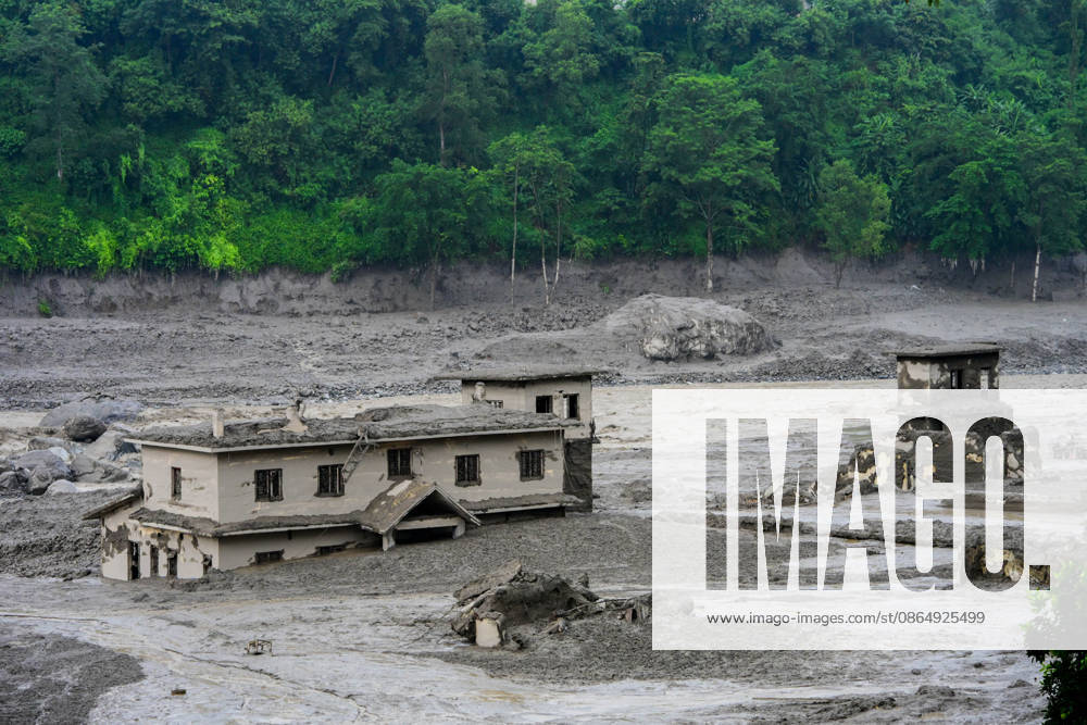 NUWAKOT, NEPAL - AUGUST 26: An aftermath view of flash floods and mudslides along the Trishuli River in Nuwakot, Nepal, on August 26, 2026. A catastrophic flash flood swept through NepalÃ¢â‚¬â ¢s northern border region after an ice-and-rock avalanche, reportedly triggered by an earthquake, caused a sudden surge in the Lhende River on the Nepal-China border and sent massive volumes of water, mud and debris downstream into the Bhote Koshi and Trishuli river systems. The disaster devastated settlements in Rasuwa and Nuwakot districts, sweeping away homes, roads, bridges, vehicles and other infrastructure and severely damaging hydropower and power facilities. In Nuwakot, riverside settlements includin - ZUMAs330 20260826_zsp_s330_047