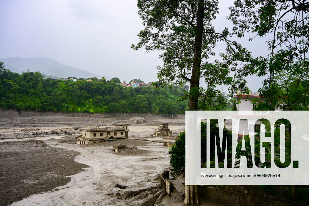 NUWAKOT, NEPAL - AUGUST 26: An aftermath view of flash floods and mudslides along the Trishuli River in Nuwakot, Nepal, on August 26, 2026. A catastrophic flash flood swept through NepalÃ¢â‚¬â ¢s northern border region after an ice-and-rock avalanche, reportedly triggered by an earthquake, caused a sudden surge in the Lhende River on the Nepal-China border and sent massive volumes of water, mud and debris downstream into the Bhote Koshi and Trishuli river systems. The disaster devastated settlements in Rasuwa and Nuwakot districts, sweeping away homes, roads, bridges, vehicles and other infrastructure and severely damaging hydropower and power facilities. In Nuwakot, riverside settlements includin - ZUMAs330 20260826_zsp_s330_048