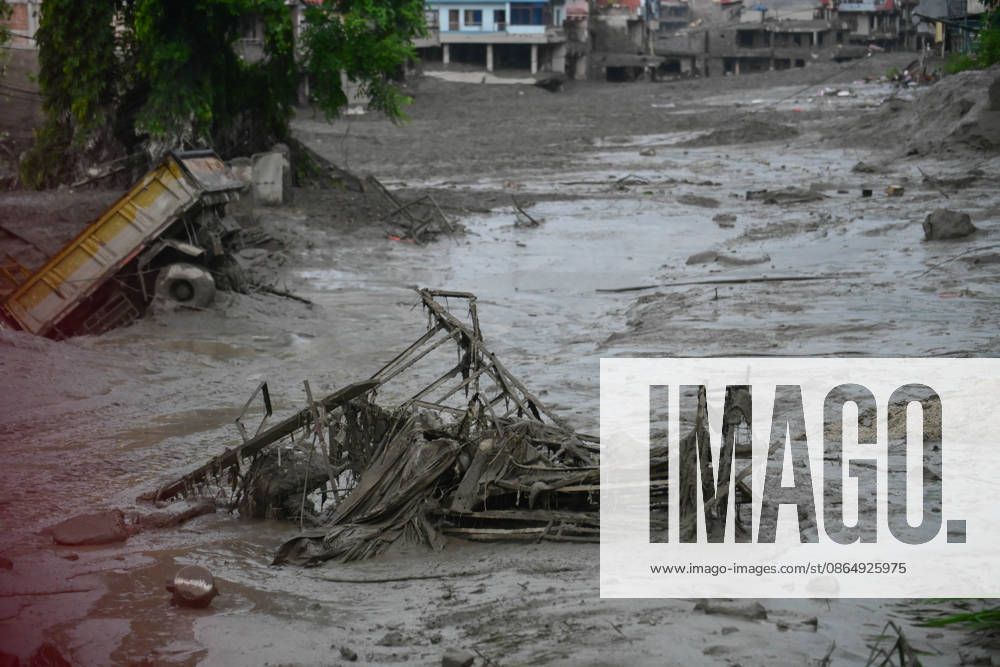 NUWAKOT, NEPAL - AUGUST 26: An aftermath view of flash floods and mudslides along the Trishuli River in Nuwakot, Nepal, on August 26, 2026. A catastrophic flash flood swept through NepalÃ¢â‚¬â ¢s northern border region after an ice-and-rock avalanche, reportedly triggered by an earthquake, caused a sudden surge in the Lhende River on the Nepal-China border and sent massive volumes of water, mud and debris downstream into the Bhote Koshi and Trishuli river systems. The disaster devastated settlements in Rasuwa and Nuwakot districts, sweeping away homes, roads, bridges, vehicles and other infrastructure and severely damaging hydropower and power facilities. In Nuwakot, riverside settlements includin - ZUMAs330 20260826_zsp_s330_057