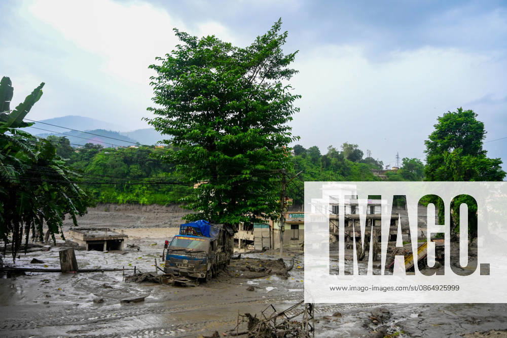 NUWAKOT, NEPAL - AUGUST 26: An aftermath view of flash floods and mudslides along the Trishuli River in Nuwakot, Nepal, on August 26, 2026. A catastrophic flash flood swept through Nepalâ€⠢s northern border region after an ice-and-rock avalanche, reportedly triggered by an earthquake, caused a sudden surge in the Lhende River on the Nepal-China border and sent massive volumes of water, mud and debris downstream into the Bhote Koshi and Trishuli river systems. The disaster devastated settlements in Rasuwa and Nuwakot districts, sweeping away homes, roads, bridges, vehicles and other infrastructure and severely damaging hydropower and power facilities. In Nuwakot, riverside settlements includin - ZUMAs330 20260826_zsp_s330_066