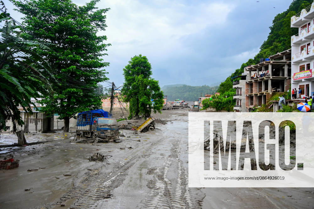 NUWAKOT, NEPAL - AUGUST 26: An aftermath view of flash floods and mudslides along the Trishuli River in Nuwakot, Nepal, on August 26, 2026. A catastrophic flash flood swept through Nepalâ€⠢s northern border region after an ice-and-rock avalanche, reportedly triggered by an earthquake, caused a sudden surge in the Lhende River on the Nepal-China border and sent massive volumes of water, mud and debris downstream into the Bhote Koshi and Trishuli river systems. The disaster devastated settlements in Rasuwa and Nuwakot districts, sweeping away homes, roads, bridges, vehicles and other infrastructure and severely damaging hydropower and power facilities. In Nuwakot, riverside settlements includin - ZUMAs330 20260826_zsp_s330_064