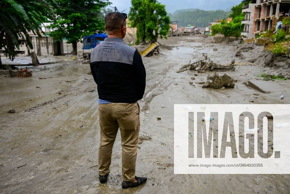NUWAKOT, NEPAL - AUGUST 26, 2026: An aftermath view of flash floods and mudslides along the Trishuli River. A catastrophic flash flood swept through Nepalâ€⠢s northern border region after an ice-and-rock avalanche, reportedly triggered by an earthquake, caused a sudden surge in the Lhende River on the Nepal-China border and sent massive volumes of water, mud and debris downstream into the Bhote Koshi and Trishuli river systems. The disaster devastated settlements in Rasuwa and Nuwakot districts, sweeping away homes, roads, bridges, vehicles and other infrastructure and severely damaging hydropower and power facilities. In Nuwakot, riverside settlements including Trishuli Bazaar, Devighat, Betr - ZUMAq101 20260826_zna_q101_040