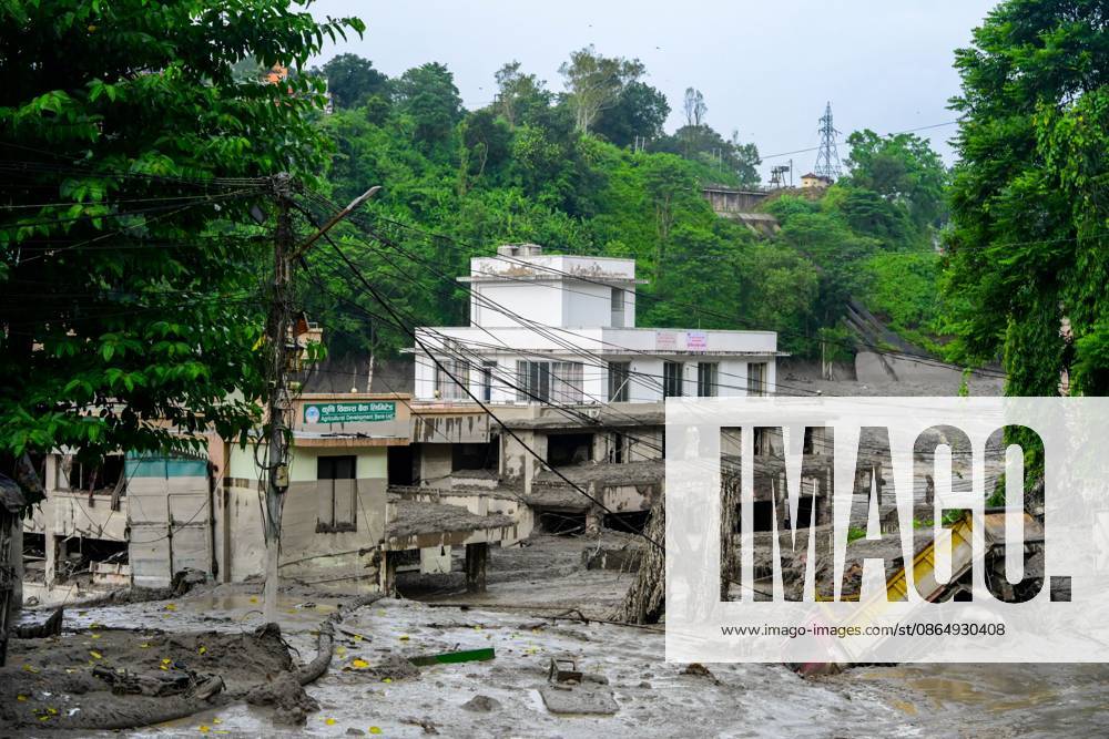 NUWAKOT, NEPAL - AUGUST 26, 2026: An aftermath view of flash floods and mudslides along the Trishuli River. A catastrophic flash flood swept through Nepalâ€⠢s northern border region after an ice-and-rock avalanche, reportedly triggered by an earthquake, caused a sudden surge in the Lhende River on the Nepal-China border and sent massive volumes of water, mud and debris downstream into the Bhote Koshi and Trishuli river systems. The disaster devastated settlements in Rasuwa and Nuwakot districts, sweeping away homes, roads, bridges, vehicles and other infrastructure and severely damaging hydropower and power facilities. In Nuwakot, riverside settlements including Trishuli Bazaar, Devighat, Betr - ZUMAq101 20260826_zna_q101_047
