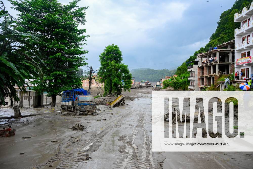 NUWAKOT, NEPAL - AUGUST 26, 2026: An aftermath view of flash floods and mudslides along the Trishuli River. A catastrophic flash flood swept through Nepalâ€⠢s northern border region after an ice-and-rock avalanche, reportedly triggered by an earthquake, caused a sudden surge in the Lhende River on the Nepal-China border and sent massive volumes of water, mud and debris downstream into the Bhote Koshi and Trishuli river systems. The disaster devastated settlements in Rasuwa and Nuwakot districts, sweeping away homes, roads, bridges, vehicles and other infrastructure and severely damaging hydropower and power facilities. In Nuwakot, riverside settlements including Trishuli Bazaar, Devighat, Betr - ZUMAq101 20260826_zna_q101_048