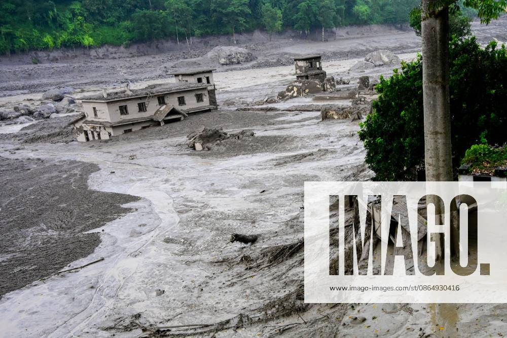NUWAKOT, NEPAL - AUGUST 26, 2026: An aftermath view of flash floods and mudslides along the Trishuli River. A catastrophic flash flood swept through NepalÃ¢â‚¬â ¢s northern border region after an ice-and-rock avalanche, reportedly triggered by an earthquake, caused a sudden surge in the Lhende River on the Nepal-China border and sent massive volumes of water, mud and debris downstream into the Bhote Koshi and Trishuli river systems. The disaster devastated settlements in Rasuwa and Nuwakot districts, sweeping away homes, roads, bridges, vehicles and other infrastructure and severely damaging hydropower and power facilities. In Nuwakot, riverside settlements including Trishuli Bazaar, Devighat, Betr - ZUMAq101 20260826_zna_q101_049