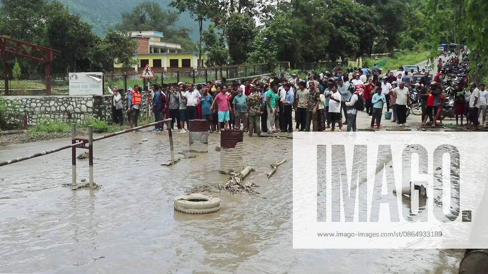Flash flood ravages Nepals Rasuwa Rasuwa Nepal , Aug 26 (ANI): People stand near an area damaged by mud-laden floodwaters following a flash flood caused by an outburst in the Bhotekoshi River, in Rasuwa on Wednesday. Around 105 Indians among the foreign nationals reported missing after the flash flood. (RSS Nepal ANI Video Grab) Rasuwa Nepal