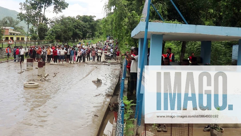 Flash flood ravages Nepals Rasuwa Rasuwa Nepal , Aug 26 (ANI): People stand near an area damaged by mud-laden floodwaters following a flash flood caused by an outburst in the Bhotekoshi River, in Rasuwa on Wednesday. Around 105 Indians among the foreign nationals reported missing after the flash flood. (RSS Nepal ANI Video Grab) Rasuwa Nepal