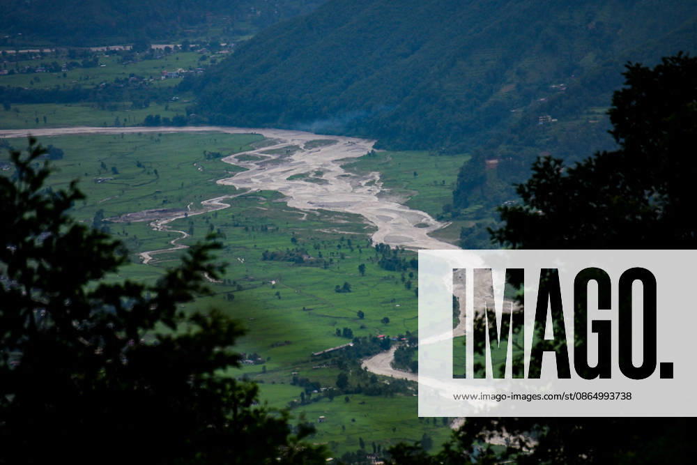 At Least 157 Killed As Devastating Flash Floods Hit Nepal A view of flash floods and mudslides along the Trishuli River in Nuwakot, Nepal, on August 26, 2026. A flash flood swept through Nepal s northern border region after an ice-and-rock avalanche caused a surge in the Lhende River near the Nepal-China border, sending water, mud and debris downstream into the Bhote Koshi and Trishuli river systems. The event damaged settlements in Rasuwa and Nuwakot districts, sweeping away homes, roads, bridges, vehicles and other infrastructure and damaging hydropower and power facilities. In Nuwakot, riverside settlements including Trishuli Bazaar, Devighat and Betrawati suffered destruction, with homes swept away and mud and debris deposited across co