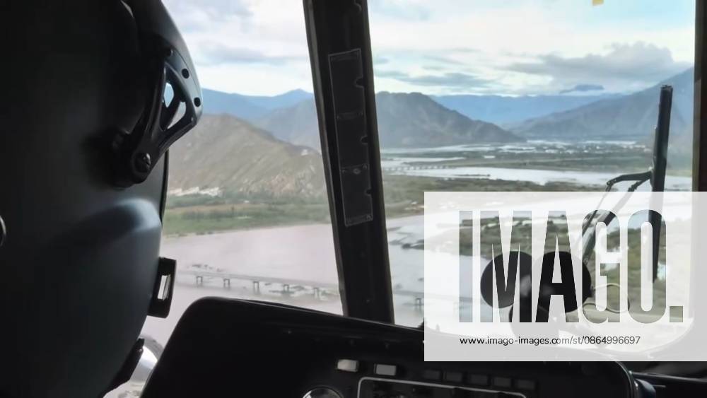 (260827) -- LHASA, Aug. 27, 2026 -- This screenshot from a video clip taken on Aug. 27, 2026 shows a military helicopter heading to Gyirong County, southwest China s Xizang Autonomous Region. The first team of 141 rescuers has arrived at the mudslide-stricken border port of Gyirong in Xizang Thursday morning after the disaster caused significant casualties along the China-Nepal border, according to China s Ministry of Emergency Management. The mudslide struck Gyirong Port in Gyirong County, Xizang, on Wednesday morning. As of 8 a.m. on Thursday, three people had been killed, 558 others remained missing, while two local villagers had been rescued, local authorities said. (Photo by Xinhua) (SpotNews) CHINA-XIZANG-MUDSLIDE-RESCUE FORCES