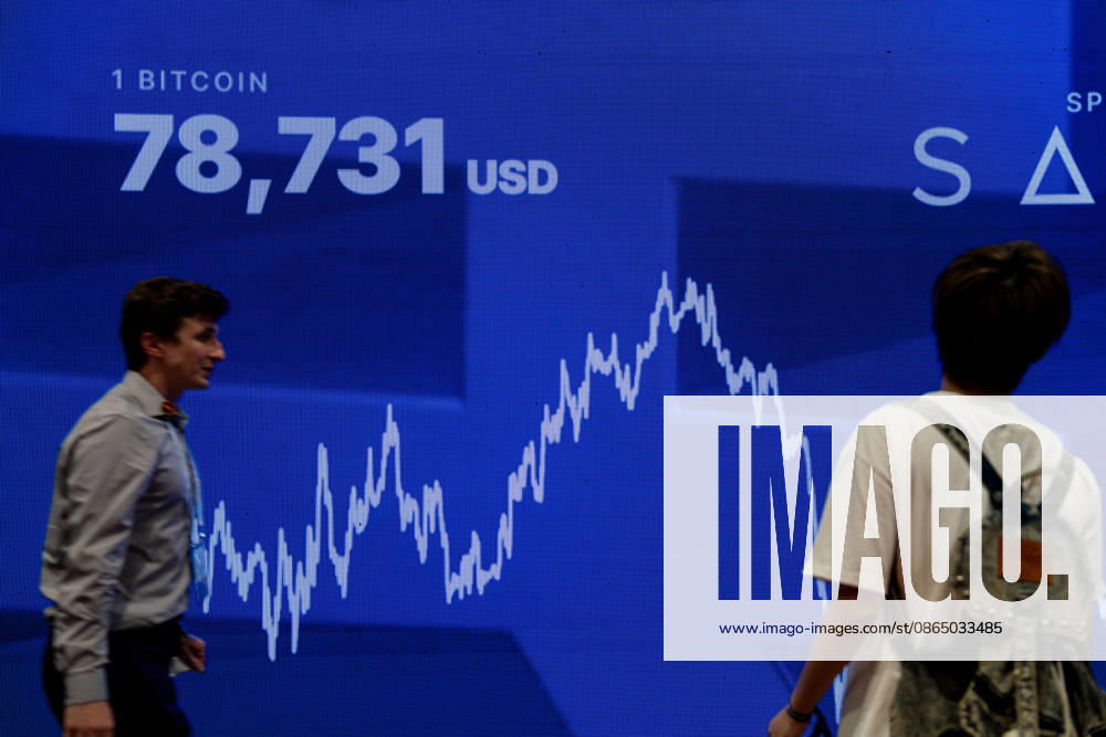 Bitcoin Asia Hong Kong 2026 People walking pass a digital display board showing the price of Bitcoin at Bitcoin Asia 2026 on August 27, 2026 in Hong Kong. (Photo by Vernon Yuen Nexpher Images) HONG KONG
