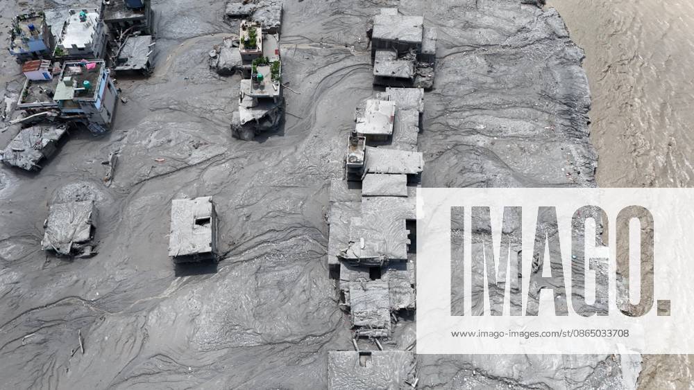An aerial view shows buildings buried in mud and debris following flash floods at Devighat in Bidur Municipality, Nuwakot district, Nepal, on Thursday, August 27, 2026. The floods, triggered by a glacial collapse and debris flow upstream, have killed at least 270 people and left 826 others out of contact, according to Nepalese authorities, with search and rescue operations continuing. Nuwakot Nepal - ZUMAg200 20260827_zap_g200_001