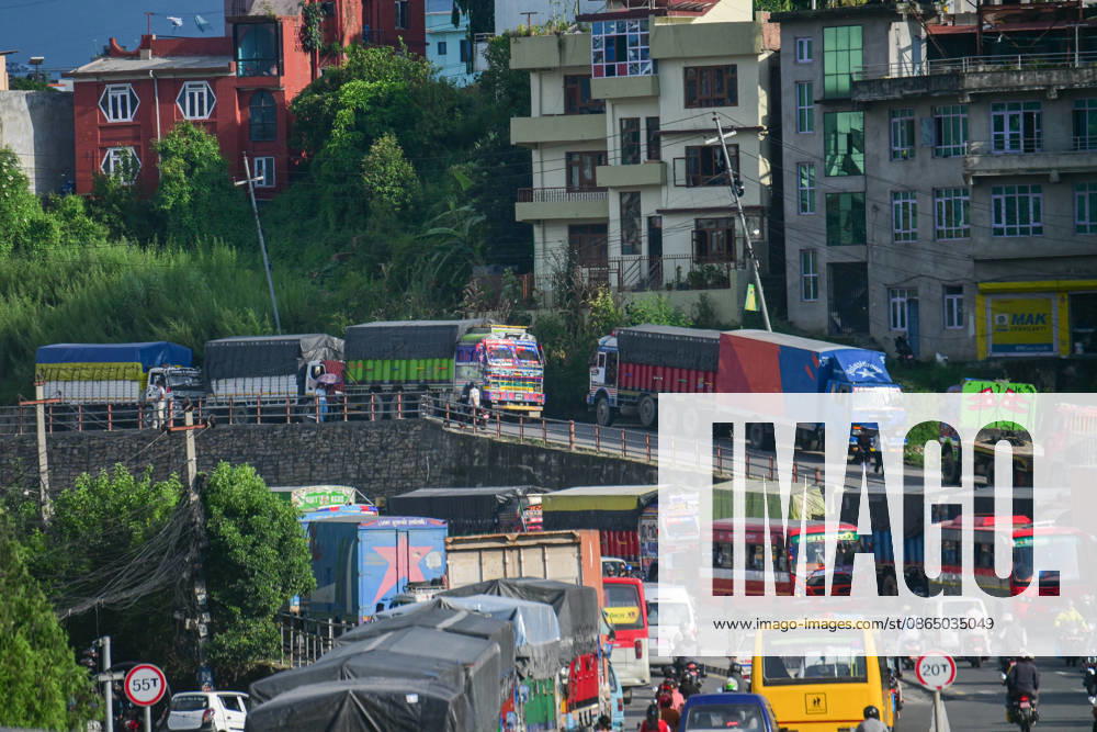 Trucks and other vehicles remain stranded along the Kalankiâ€Thankotâ€Nagdhunga route in Kathmandu, Nepal, on August 27, 2026, as major highways remain closed following devastating flash floods and landslides. The stranded vehicles have occupied multiple lanes along the road, causing traffic congestion and further disrupting movement in the area. The floods swept through Rasuwa and other parts of central Nepal before surging downstream along the Trishuli and Narayani river systems, damaging roads, bridges, settlements and other infrastructure. The Nagdhungaâ€Muglin route, a key road connection between Kathmandu and other parts of the country, has been closed, disrupting the movem - ZUMAs330 20260827_zsp_s330_011