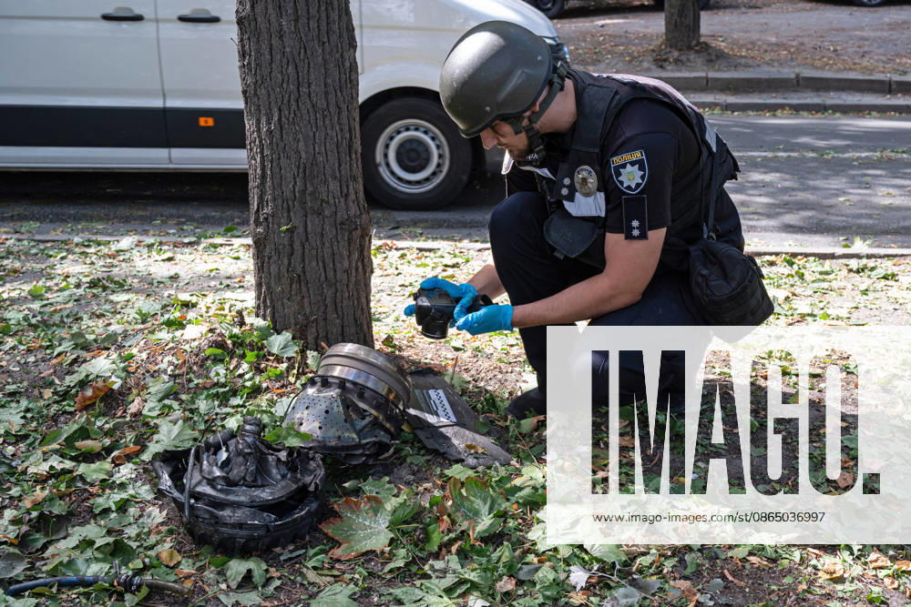 A forensic expert from Ukraine’s National Police takes pictures of fragments of a Russian drone found on Parkova Doroha Street in the Pecherskyi district after a Russian attack, Kyiv, Ukraine, August 27, 2026. Since the night of August 27, the Russian army has been striking the Ukrainian capital with ballistic missiles and drones. Overnight and daytime attacks and falling debris caused destruction across several districts of Kyiv, damaging residential buildings, cars, gymnasium premises and a medical facility. (Photo by Danylo Antoniuk Ukrinform) Forensic experts examine wreckage of Russian drone in Kyiv