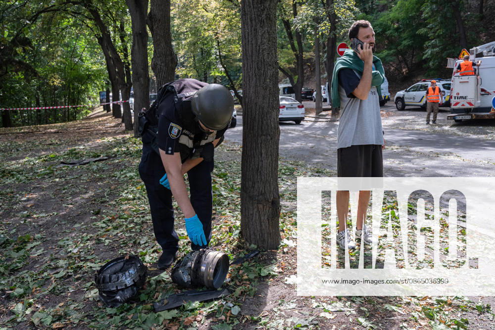 A forensic expert examines fragments of a Russian drone found on Parkova Doroha Street in the Pecherskyi district after a Russian attack, Kyiv, Ukraine, August 27, 2026. Since the night of August 27, the Russian army has been striking the Ukrainian capital with ballistic missiles and drones. Overnight and daytime attacks and falling debris caused destruction across several districts of Kyiv, damaging residential buildings, cars, gymnasium premises and a medical facility. (Photo by Danylo Antoniuk Ukrinform) Forensic experts examine wreckage of Russian drone in Kyiv