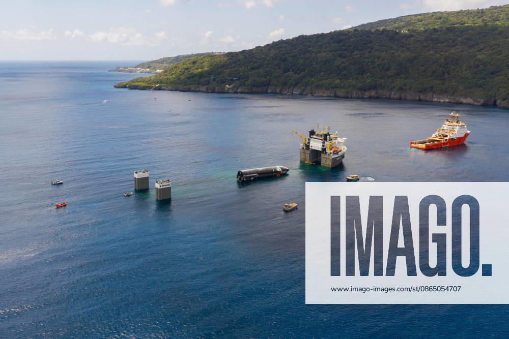 SpaceX engineers spent several days inspecting Ship 40 in the waters off Christmas Island as seen in pictures released on Thursday, August 27, 2026. They collected heatshield samples and gained vital insight into how the vehicle handled reentry, with improvements now planned for future vehicles. Starship has now been loaded onto a semi-submersible ship to begin the several-month journey back to Starbase. WAX2026082706 SPACEX