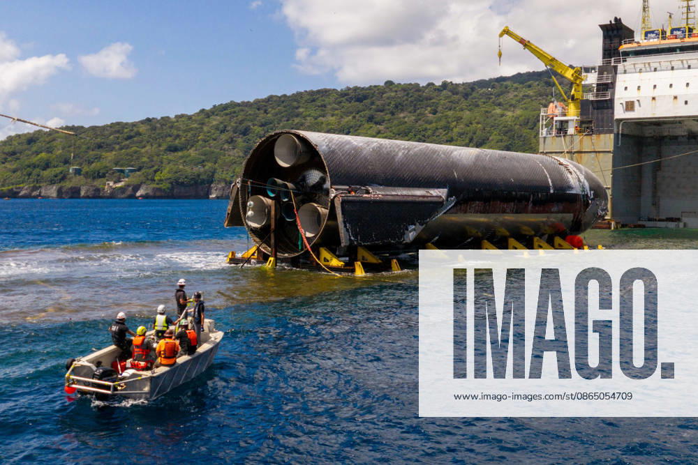 SpaceX engineers spent several days inspecting Ship 40 in the waters off Christmas Island as seen in pictures released on Thursday, August 27, 2026. They collected heatshield samples and gained vital insight into how the vehicle handled reentry, with improvements now planned for future vehicles. Starship has now been loaded onto a semi-submersible ship to begin the several-month journey back to Starbase. WAX2026082707 SPACEX