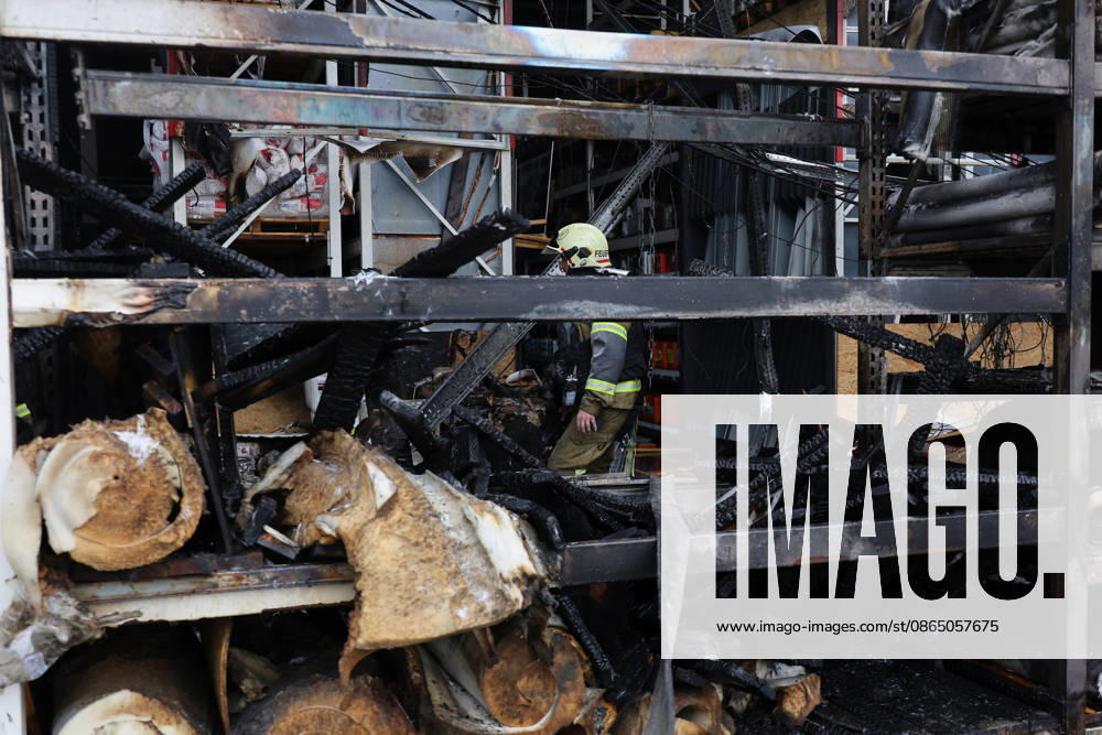 A rescuer works at an Epicenter hypermarket in the Osnovianskyi district, destroyed by a Russian drone attack, Kharkiv, Ukraine, August 27, 2026. A 40-year-old man was killed, and four others were injured in the strike. (Photo by Viacheslav Madiievskyi Ukrinform) Russian drone attacks home improvement hypermarket in Kharkiv