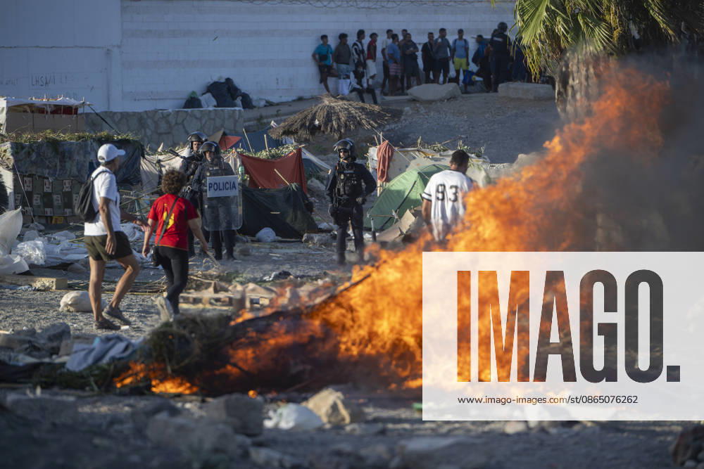 Protest Against Migrants in Ceuta Street furniture and other items are set ablaze during a protest against the situation caused by the massive influx of migrants, on August 27, 2026, in Ceuta, Spain. Protesters attempted to block Red Cross volunteers from distributing food bags to migrants on Trampolín Beach and caused disturbances on Benítez Beach in Ceuta, which led to a police crackdown, after they entered the migrant encampments where people spend the night in the area and caused damage, including the burning of personal belongings. AUGUST 27, 2026 MIGRATION CRISIS Ceuta, Spain