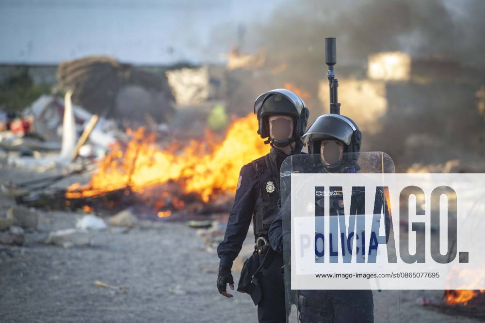 Protest Against Migrants in Ceuta: Police officers during a demonstration protesting the situation caused by the mass arrival of migrants, on August 27, 2026, in Ceuta, Spain. Protesters attempted to block Red Cross volunteers from distributing food bags to migrants on Trampolín Beach and caused disturbances on Benítez Beach in Ceuta, which led to police charges, after they broke into the migrant encampments where people spend the night in the area and caused damage, including the burning of personal belongings. AUGUST 27, 2026 PIXELATED MIGRATION CRISIS Ceuta Ceuta, Spain
