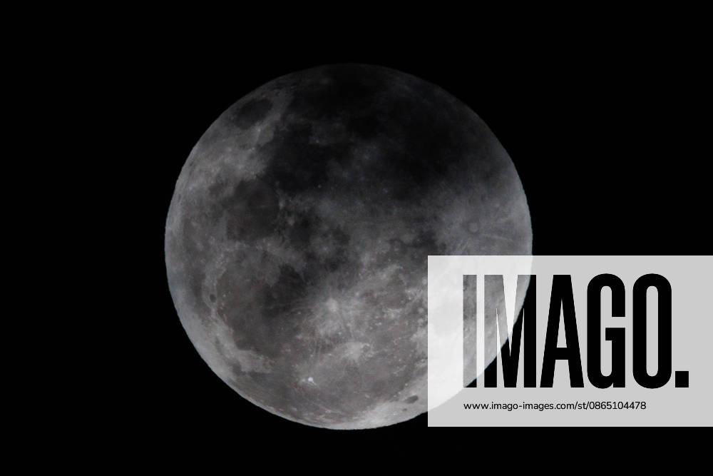 Santiago, August 27, 2026: Lunar eclipse known as the Blood Moon under cloudy skies in Santiago, Diego Martin Aton, Chile; Aton 1184786 jpeg