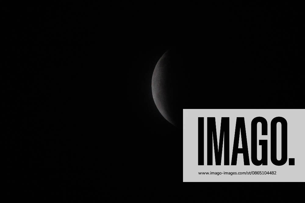 Santiago, August 27, 2026: Lunar eclipse known as the Blood Moon under cloudy skies in Santiago, Diego Martin Aton, Chile; Aton 1184789 jpeg