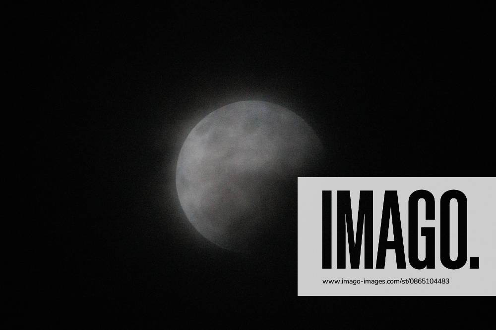 Santiago, August 27, 2026: Lunar eclipse known as the Blood Moon under cloudy skies in Santiago, Diego Martin, Aton, Chile; Aton 1184790 jpeg