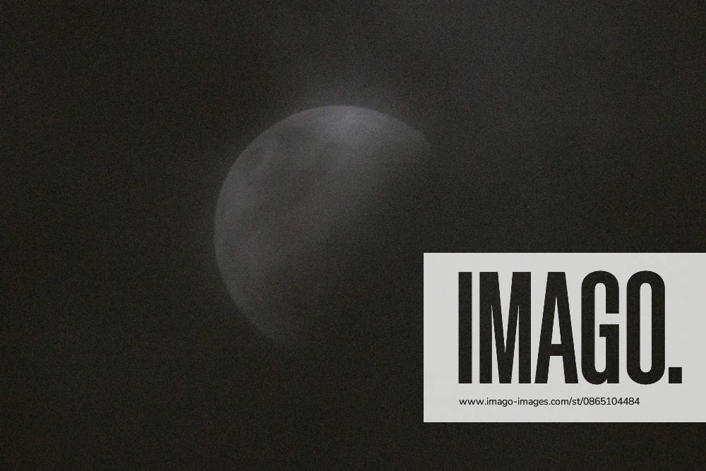 Santiago, August 27, 2026: Lunar eclipse known as the Blood Moon under cloudy skies in Santiago, Diego Martin Aton, Chile; Aton 1184791 jpeg