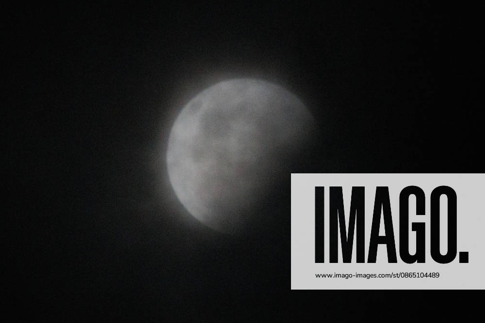 Santiago, August 27, 2026: A lunar eclipse known as the Blood Moon under cloudy skies in Santiago, Diego Martin Aton, Chile; Aton 1184793 jpeg