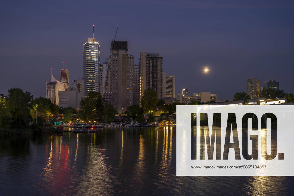 Moon during partial eclipse seen from Austrias capital Vienna, in frame is Austrias highest building, the DC Tower as well as the Vienna International Centre, also known as UNO City, housing the United Nations. Vienna Vienna Austria